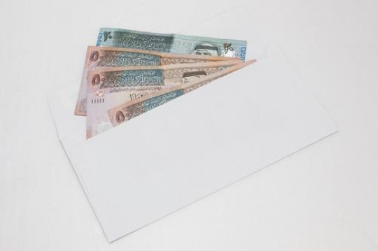 jordanian dinars in an envelope