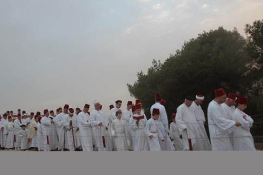 members of the Samaritan community march atop Mount Gerizim, above the West Bank city of Nablus,
