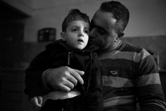 palestinian Worker with his son