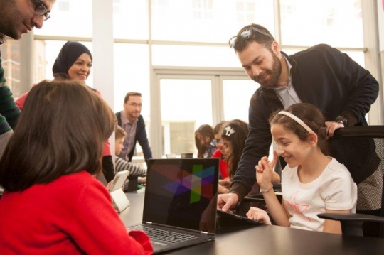 Kids and Teachers at Computer Class