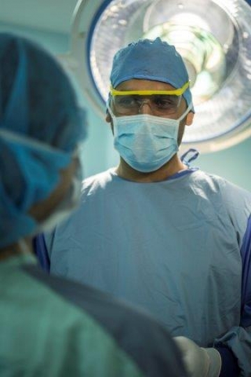 A Surgeon Talking to Assistant at Operation Room