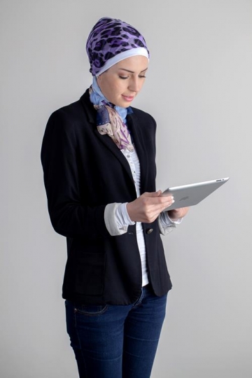 young woman holding ipad