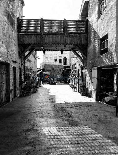 Black and White Photograph of Dubai Old Market Alley with Bridge