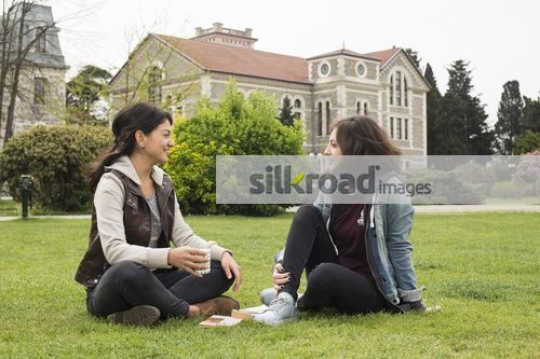 Woman sitting together talking|