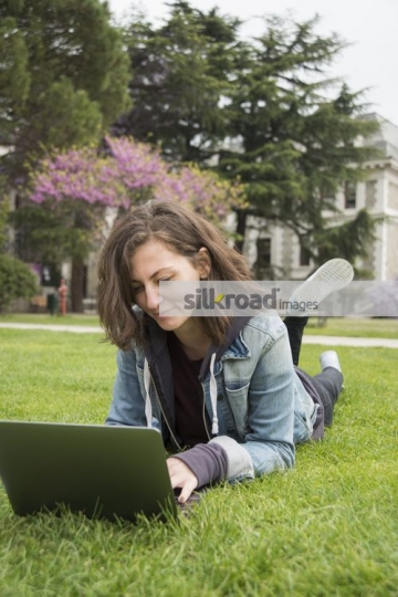 Student using her laptop on campus|