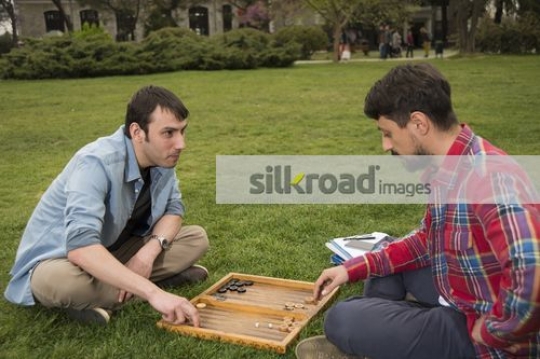 Two men playing a game together|