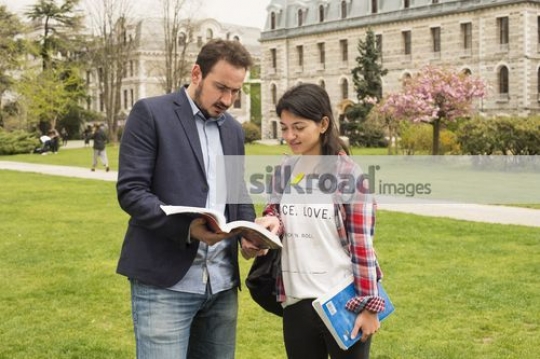 Professor talking to the student |