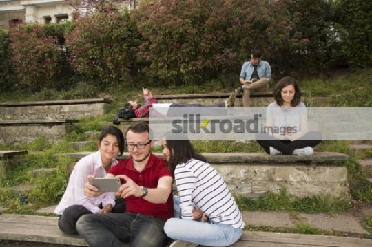 Friends taking a selfie together on campus|