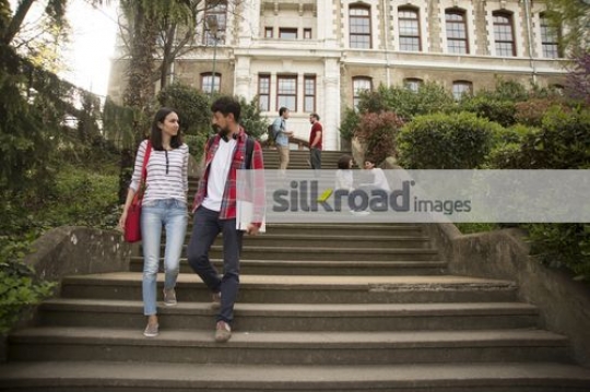 Friends walking down the stairs|