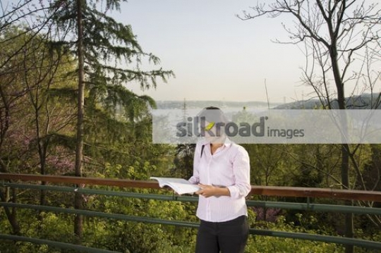 Student reading a book|