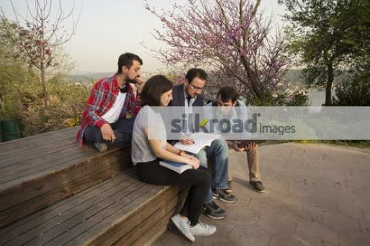 University Students talking to the professor|