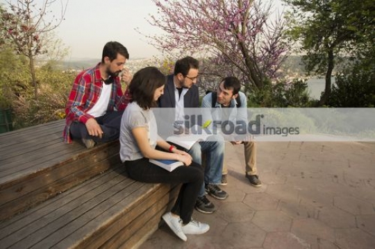 Group of students sitting with the professor|