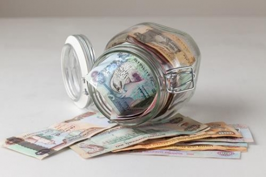 a glass jar filled with uae di