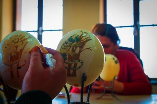woman painting Ostrich eggs