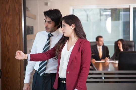 businessman and businesswoman having a conversation