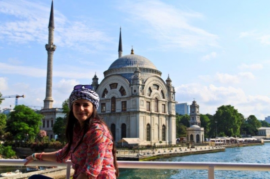 woman standing in front of a mosque in istanbul