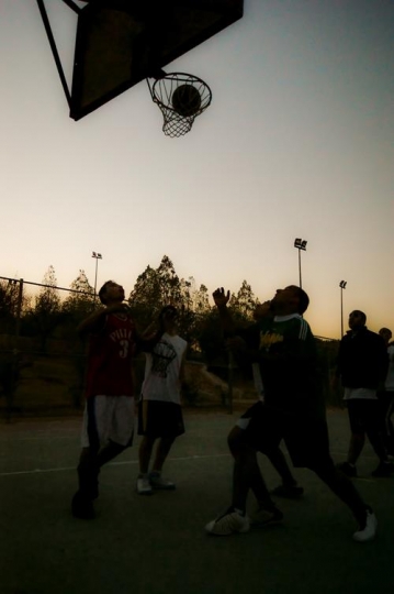 group playing basketball on co