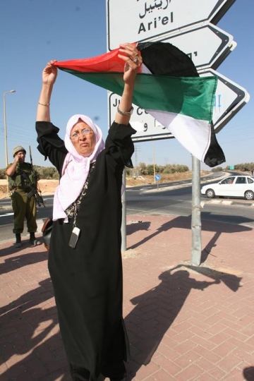 palestinian woman holding flag