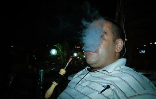 man smoking sheesha 