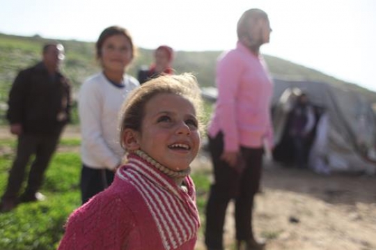 Cute little girl is playing wi