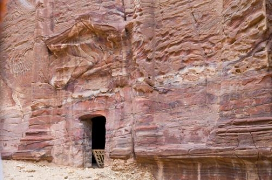 Abstract layered sandstone wall in world wonder Petra, Jordan