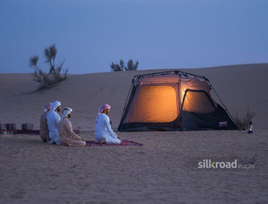 Group of friends seated in prayer