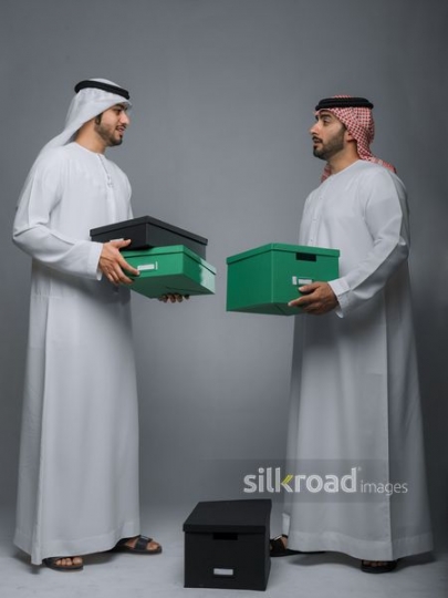Two colleagues carrying boxes