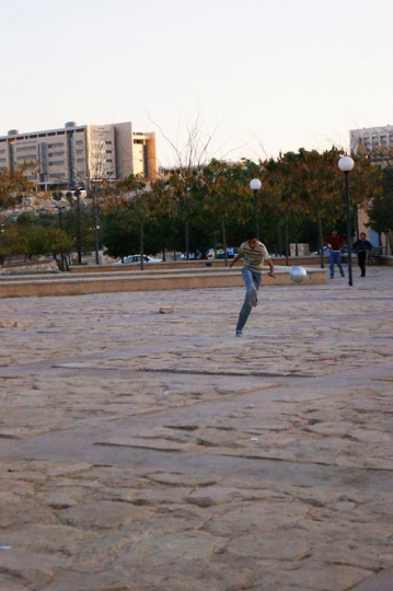 boys playing football in king hussein park,jordan