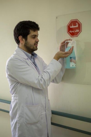 Doctor Sanitising his Hands