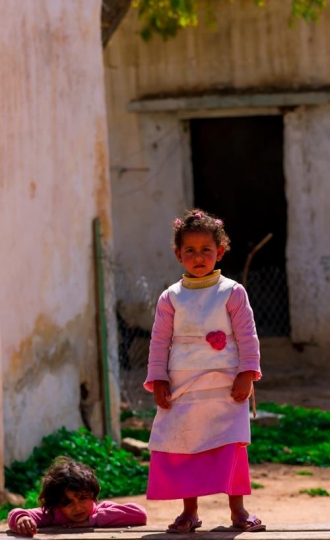 View of the town of Salt in Jordan, girls playing.