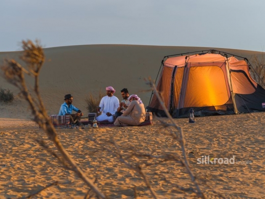 Friend enjoying their time in desert camp