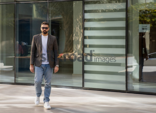Close-Up of a Professional Man Exiting a Corporate Building
