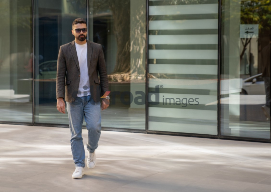 Close-Up of a Professional Man Exiting a Corporate Building