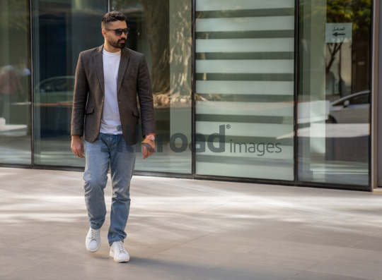 Close-Up of a Professional Man Exiting a Corporate Building