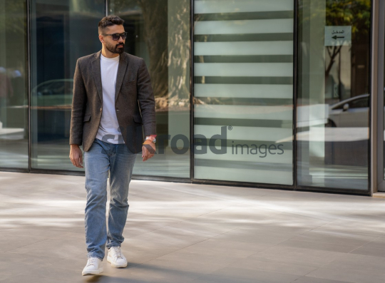 Close-Up of a Professional Man Exiting a Corporate Building