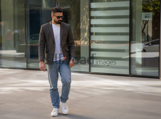 Close-Up of a Professional Man Exiting a Corporate Building
