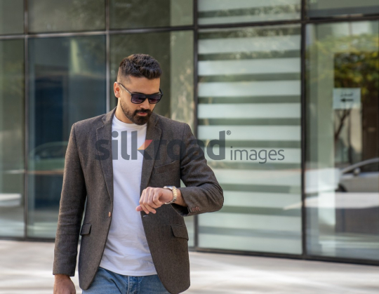 Close-Up of a Professional Man Exiting a Corporate Building