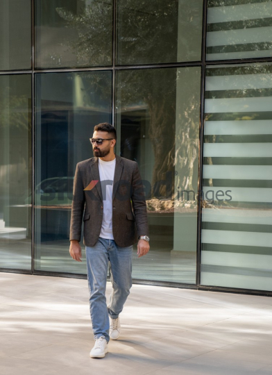 Close-Up of a Professional Man Exiting a Corporate Building