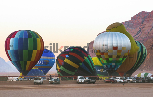 Colorful Hot Air Balloons Preparing for Takeoff in Wadi Rum Desert, Jordan