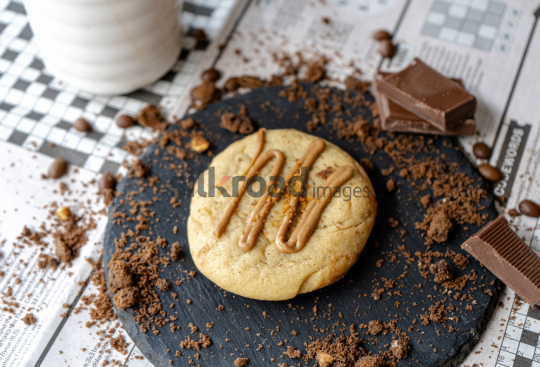 Cup of Coffee and Chocolate on Newspaper Games Page