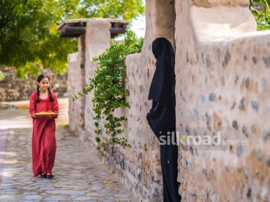 Girl walking towards neighbor|-