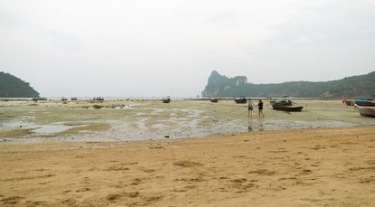 shore with sailors going in water