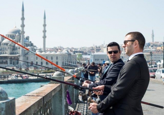 Businessmen Competing by Galata Bridge Istanbul
