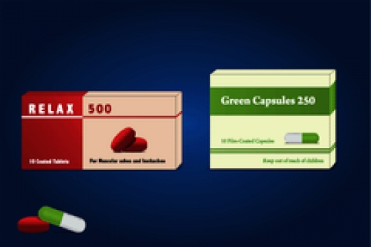 capsules and pills packed in blisters on blue background