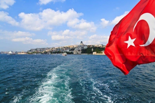 turkish flag at the back of a boat