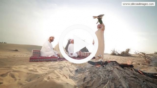 Man demonstrating falcon feature to friends