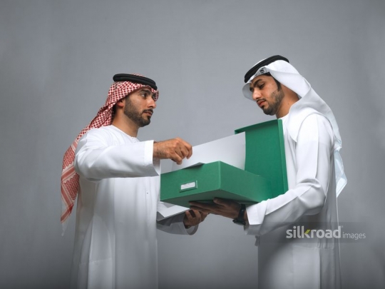 Employees checking the files in the box