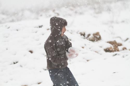 Fresh snow cover, at winter in Palestine, everbody happy and outside and play in the snow