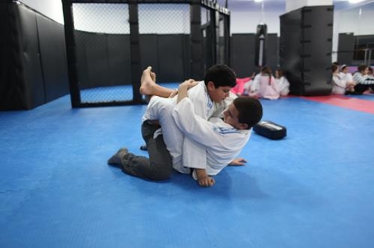 Children in a gym in martial arts training exercising karate, karate fighting Center