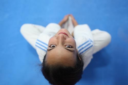 Children in a gym in martial arts training exercising karate, karate fighting Center